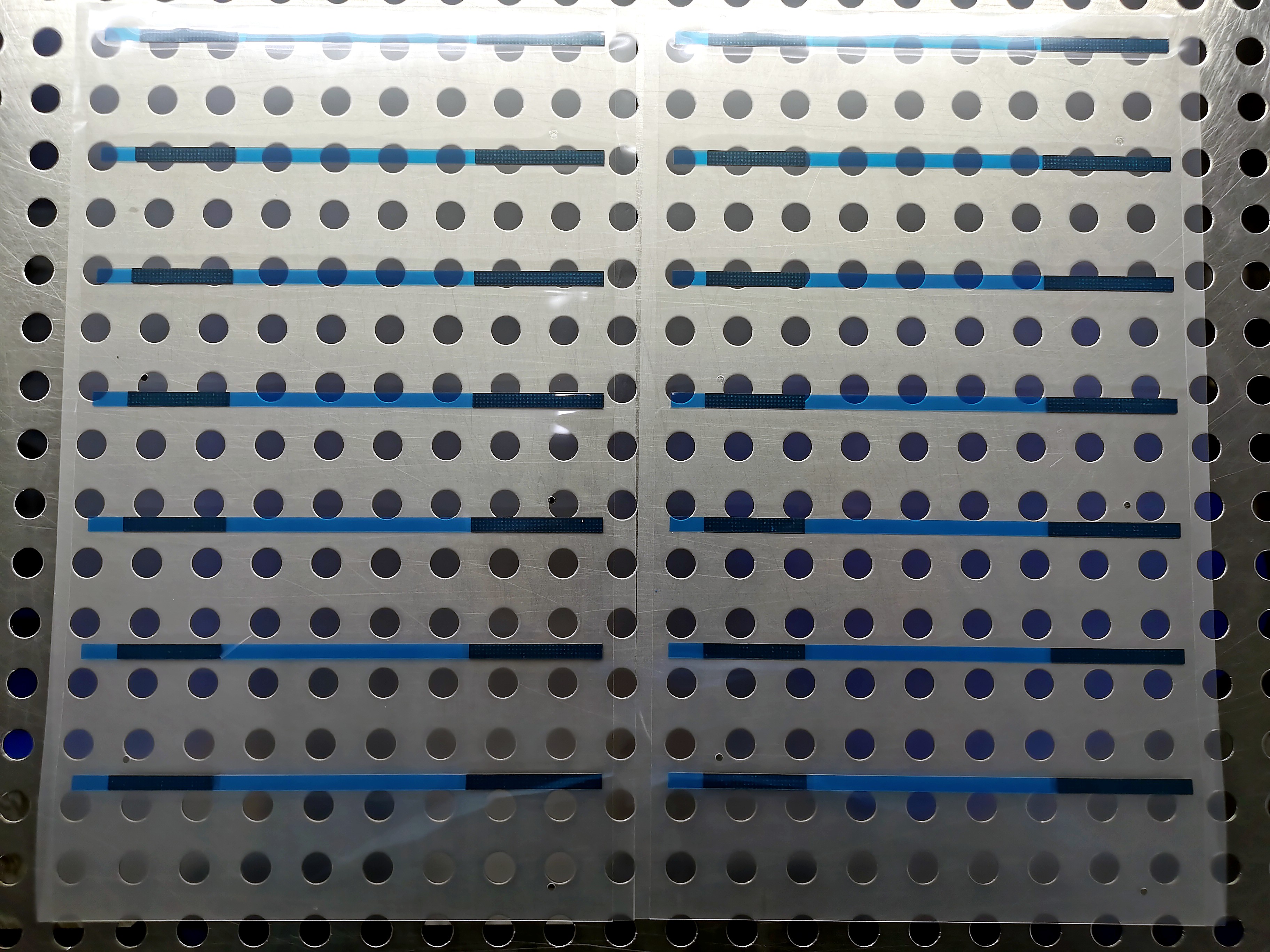 Conductive EMI shielding tape die-cut strips on steel plate